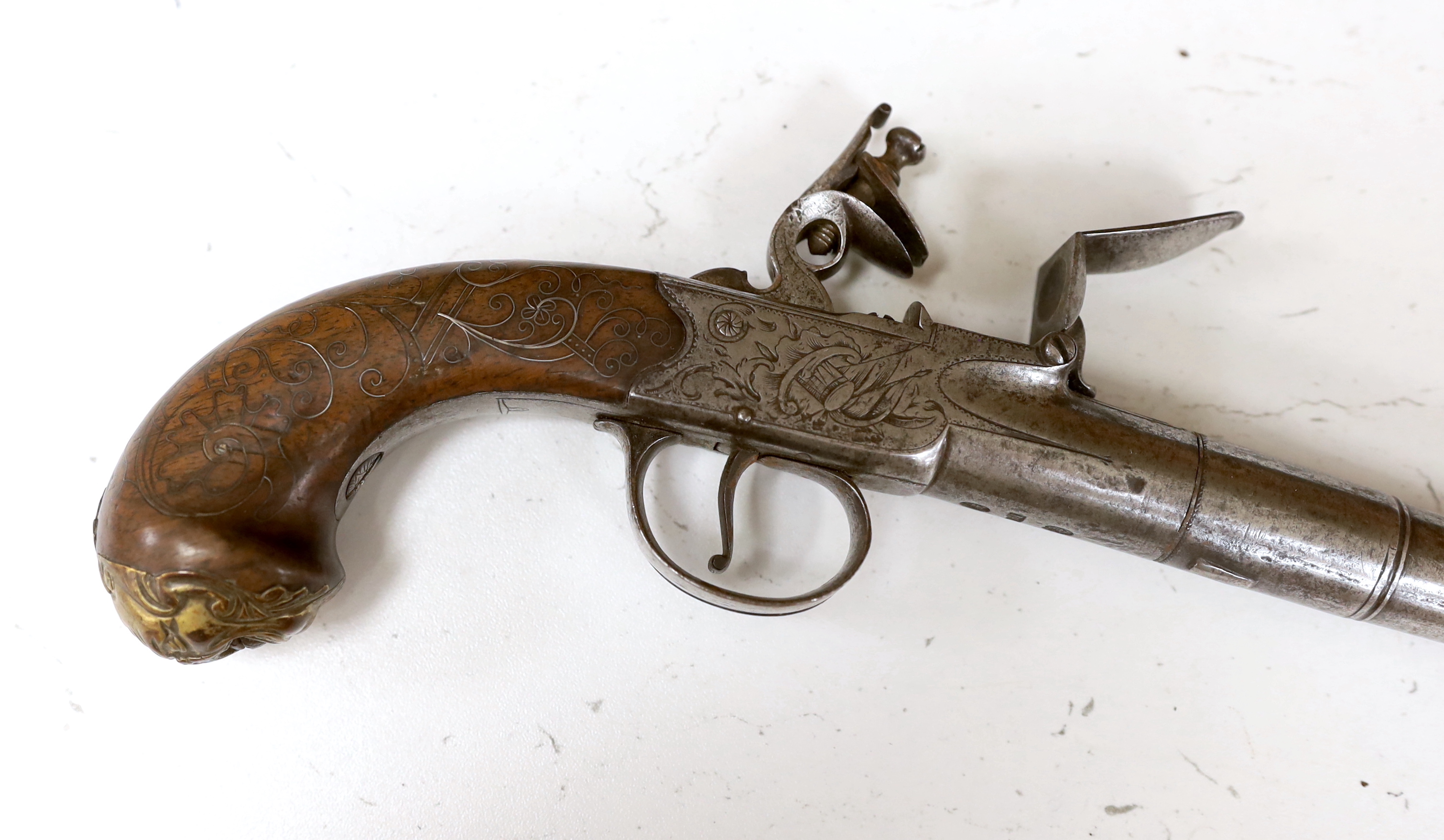 A Queen Anne style boxlock flintlock cannon barrelled holster pistol by T. London, maker's mark IH